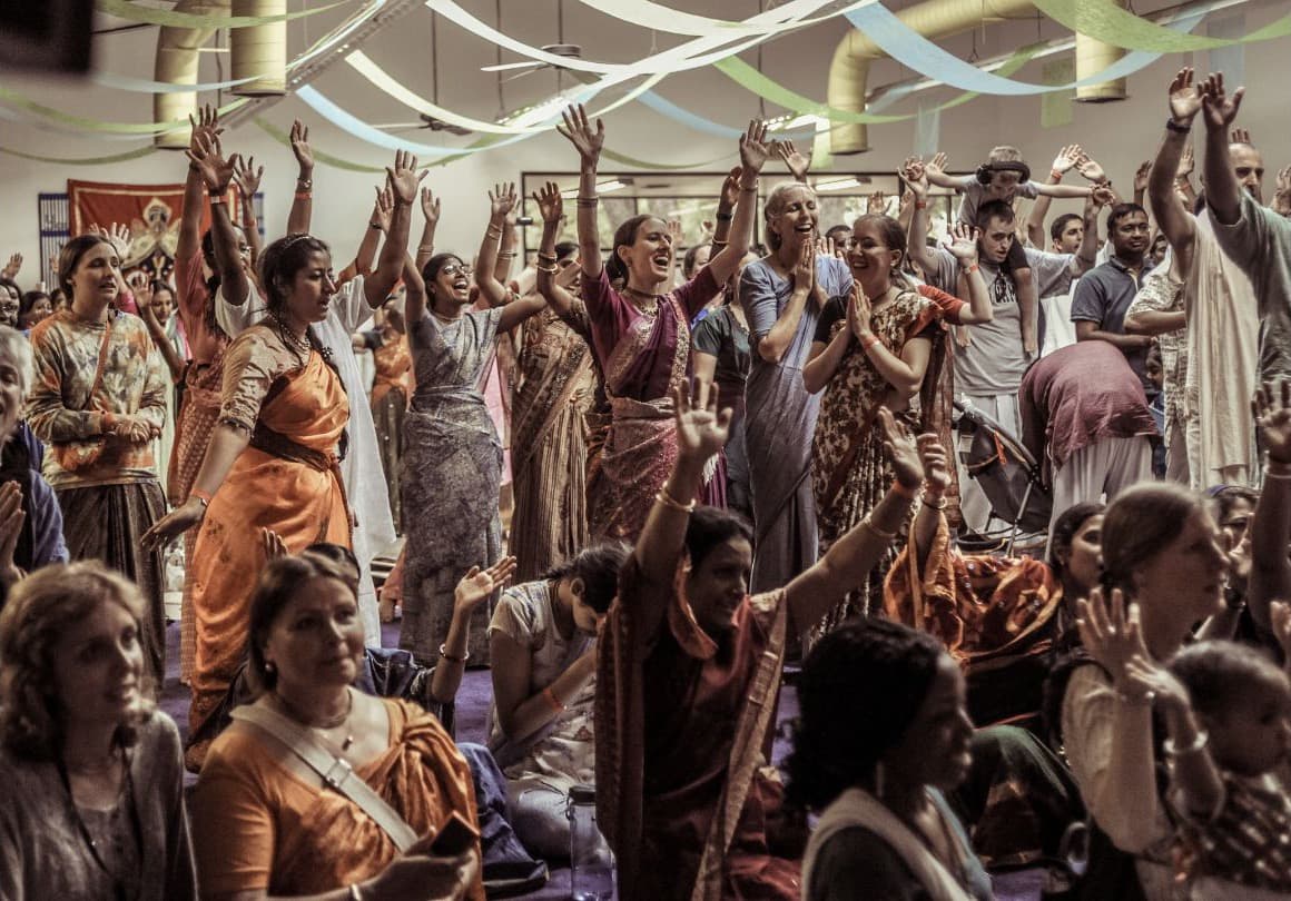 ISKCON devotees dancing together at a festival in Texas